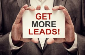 Man holding a card that reads "Get More Leads!"