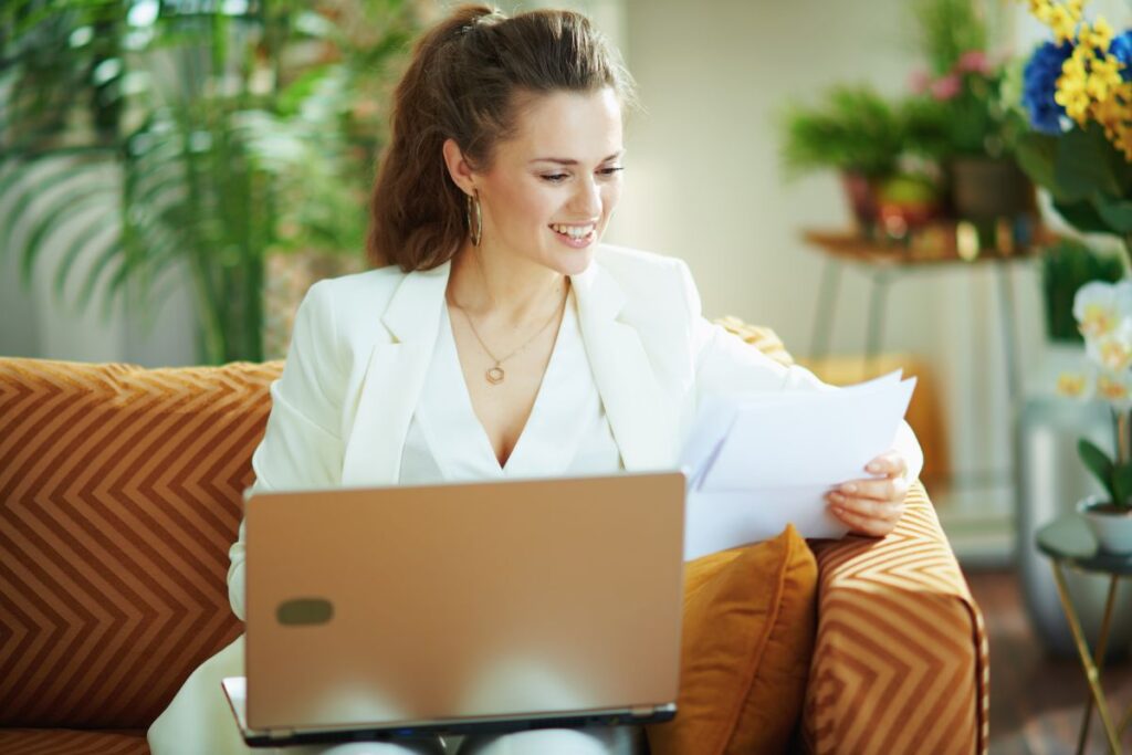 Smiling business woman working on computer